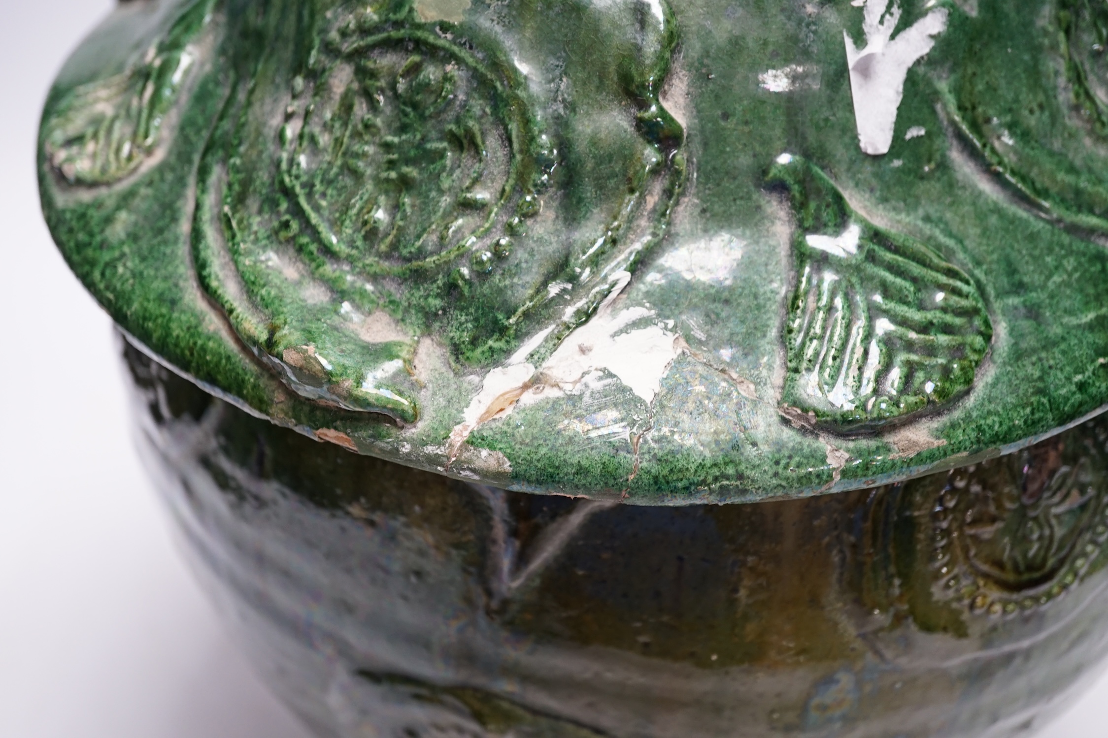 A Chinese Buddhist green glazed jar and cover, Song-Yuan dynasty, 33cm